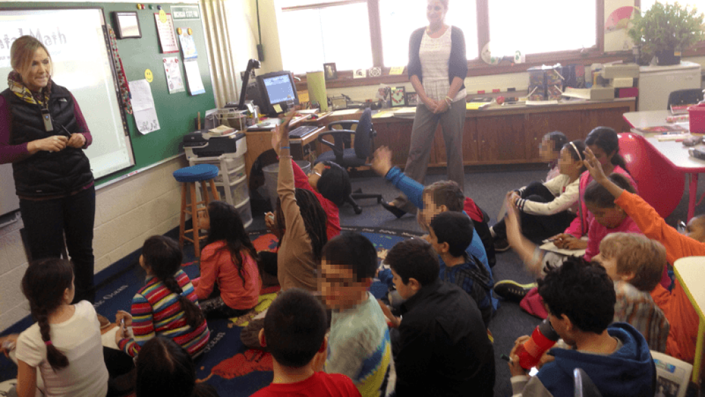 Mrs. Wever speaking to her class