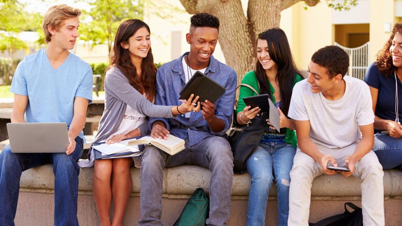 Group of high school students working on project