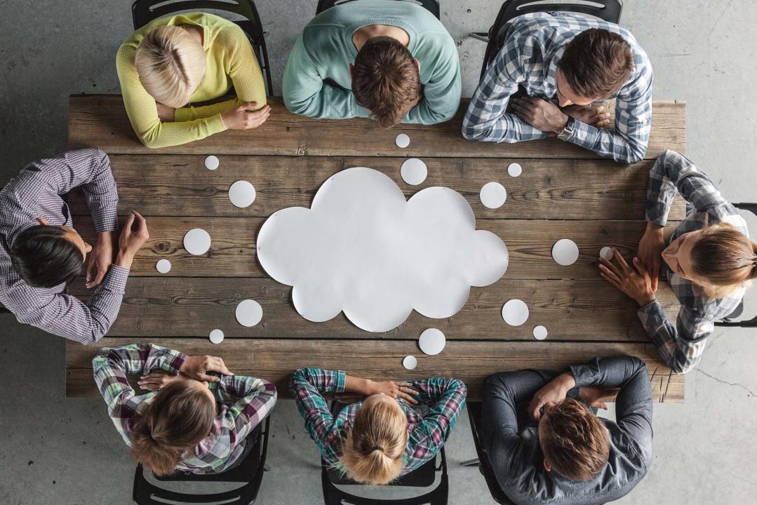 mentors at a table brainstorming
