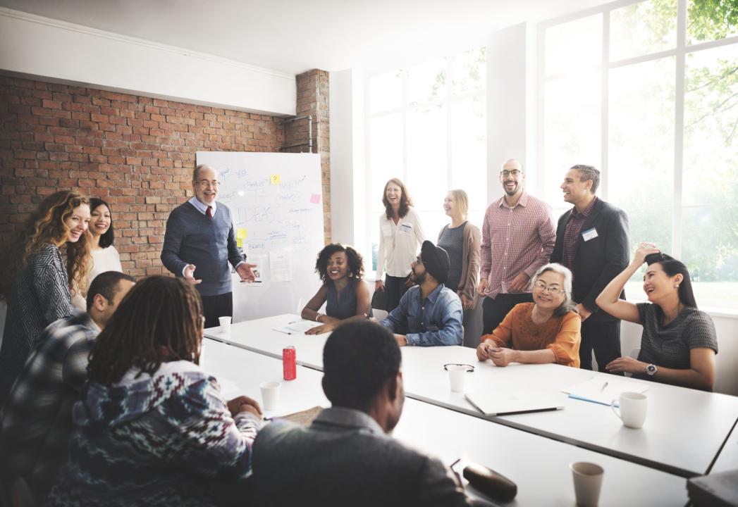 A group of educators sitting at a table and collaborating