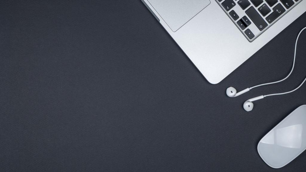 Minimal home office desk. Top view shot. Freelancer workplace concept