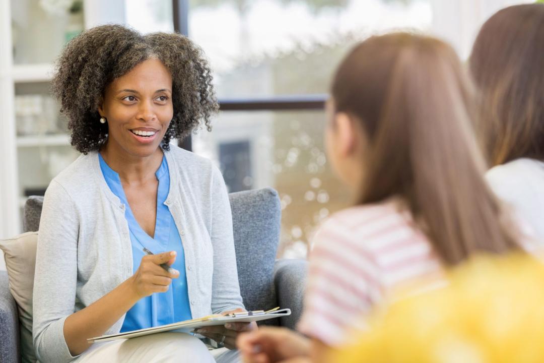 Mental health professional speaks candidly with two patients