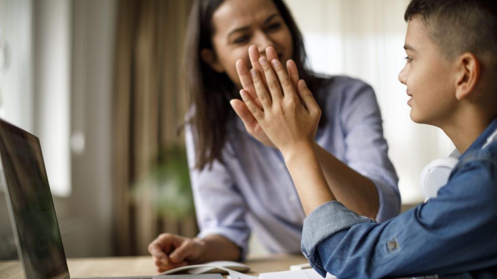 parent high-fiving child