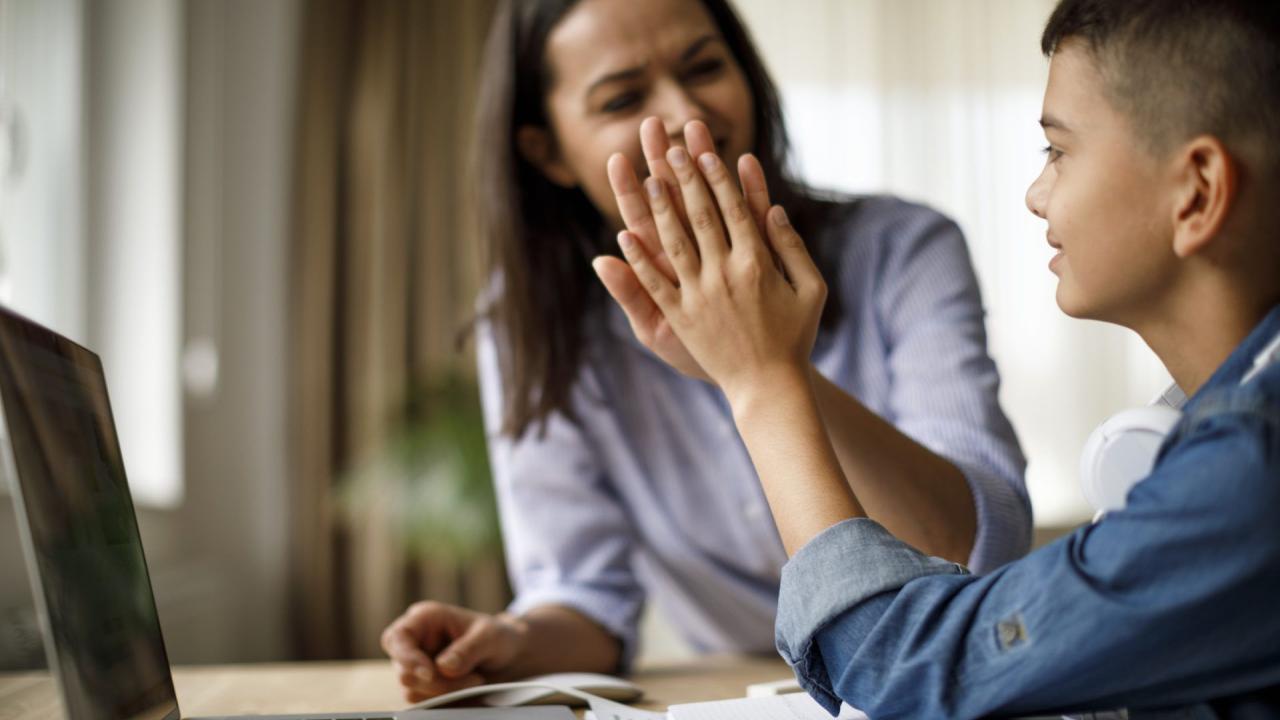 parent high-fiving child
