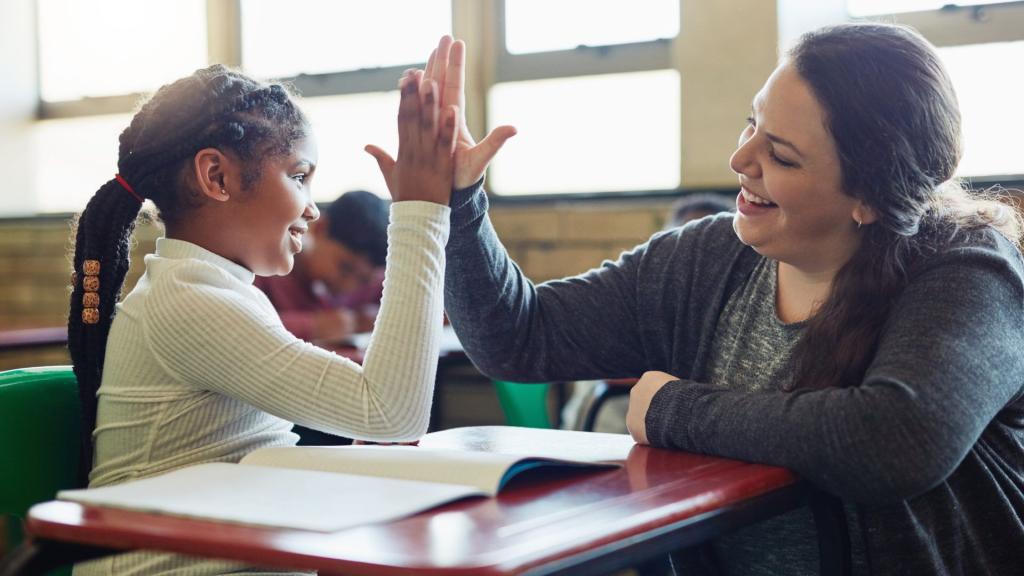 teacher giving a student a high five
