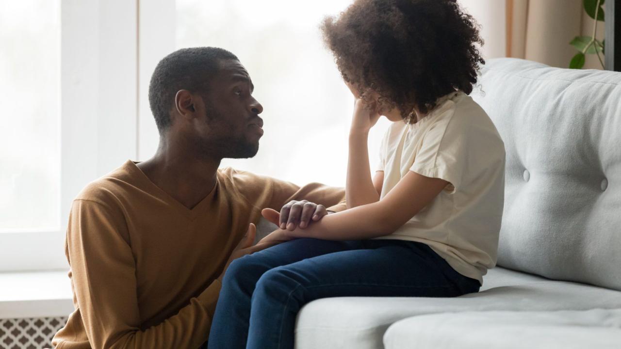 Loving dad comforting crying daughter showing empathy