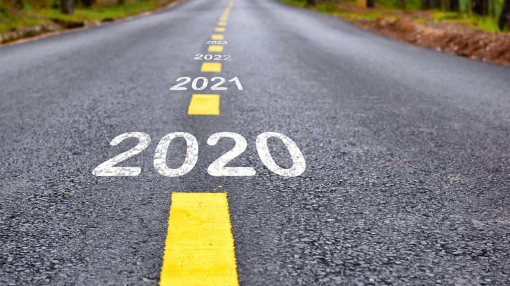 Road with years listed between yellow lines - 2020 - 2021 - 2022 and beyond