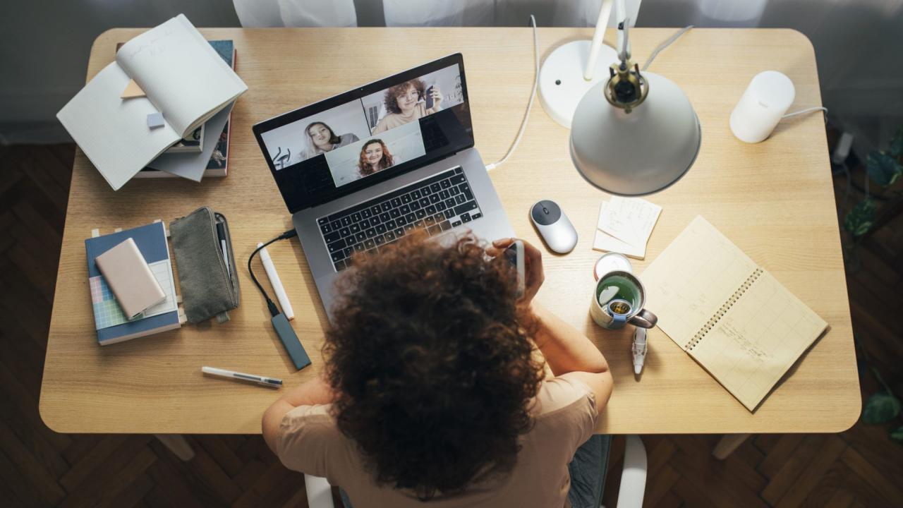 Social Distancing and Self Care: Happy Woman Teleconferencing from Home