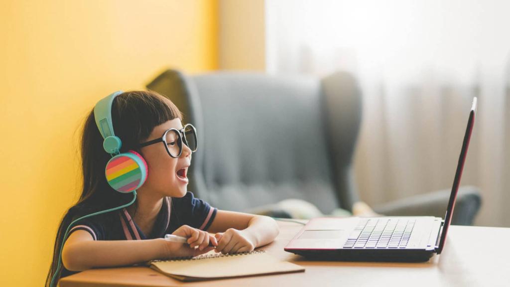 Young Asian Cute girl studying with laptop at home during pandemic