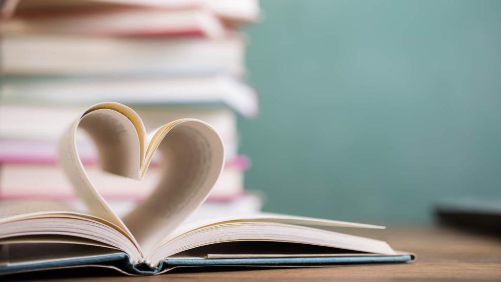 Heart shape in open school book pages.