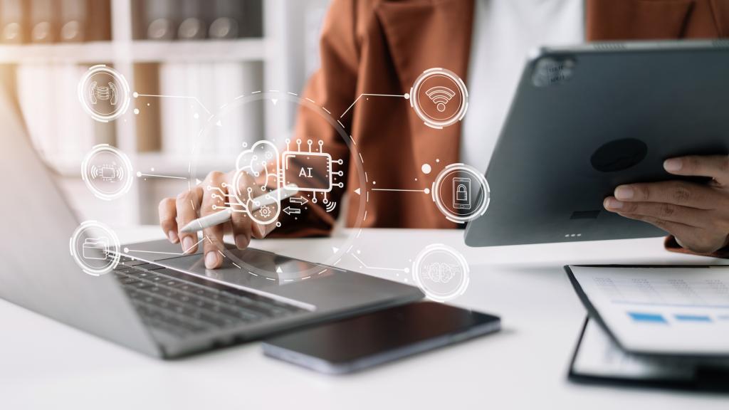 AI or Artificial Intelligence technology. Businessman using a smartphone and laptop computer chatting with an intelligent artificial intelligence. Futuristic technology, automate Chat Bot, Smart Ai.