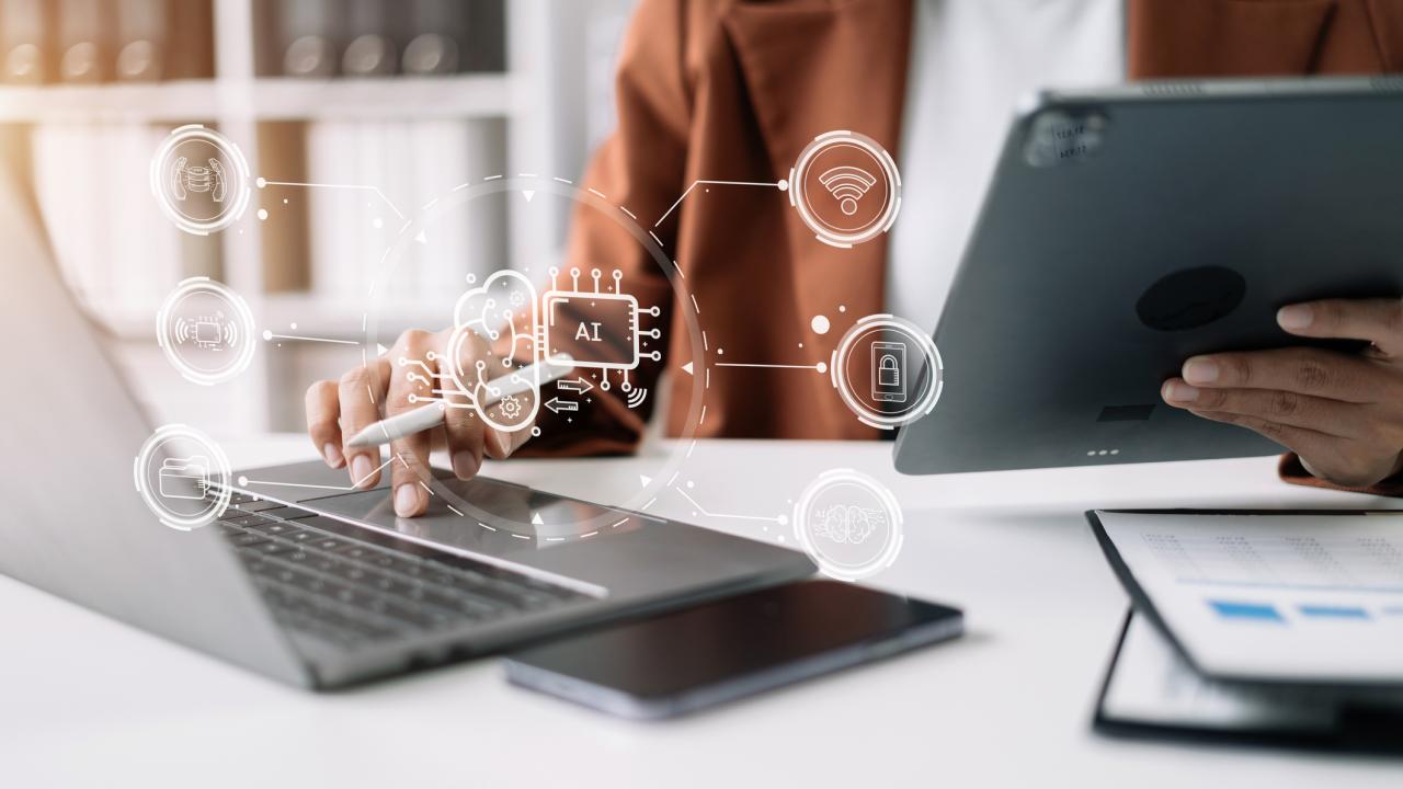 AI or Artificial Intelligence technology. Businessman using a smartphone and laptop computer chatting with an intelligent artificial intelligence. Futuristic technology, automate Chat Bot, Smart Ai.