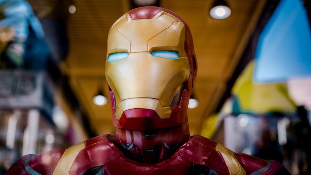 A close up view of a red and gold colored robot toy.