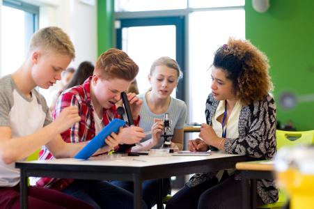 Kids Experimenting with Microscopes in a Science Lesson
