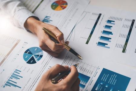 two people going over charts and graphs