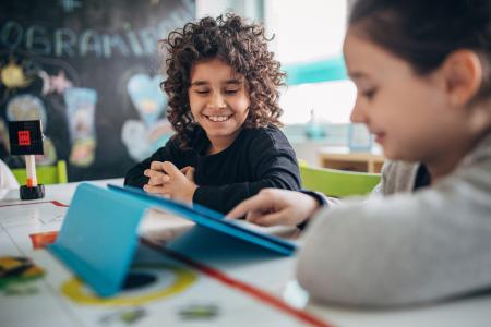 Preschool girl using digital tablet
