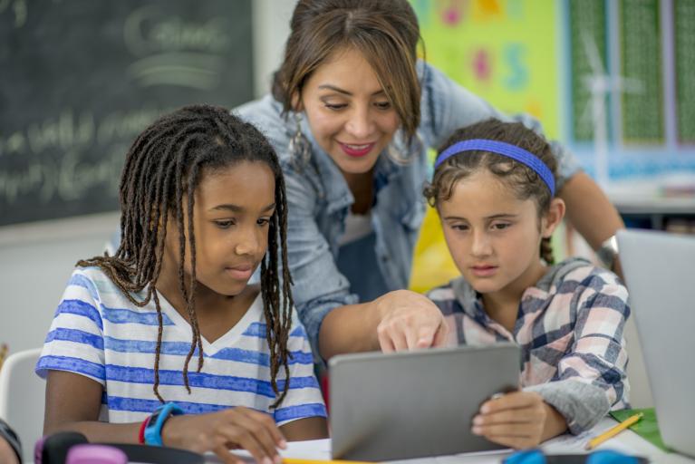 Teacher Helping Children