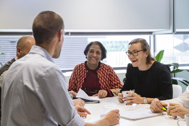 Female Mentor of a Successful Business Team