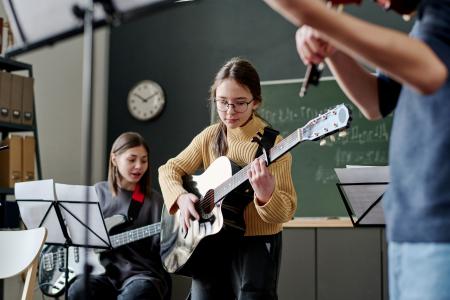 Girl Playing In School Band