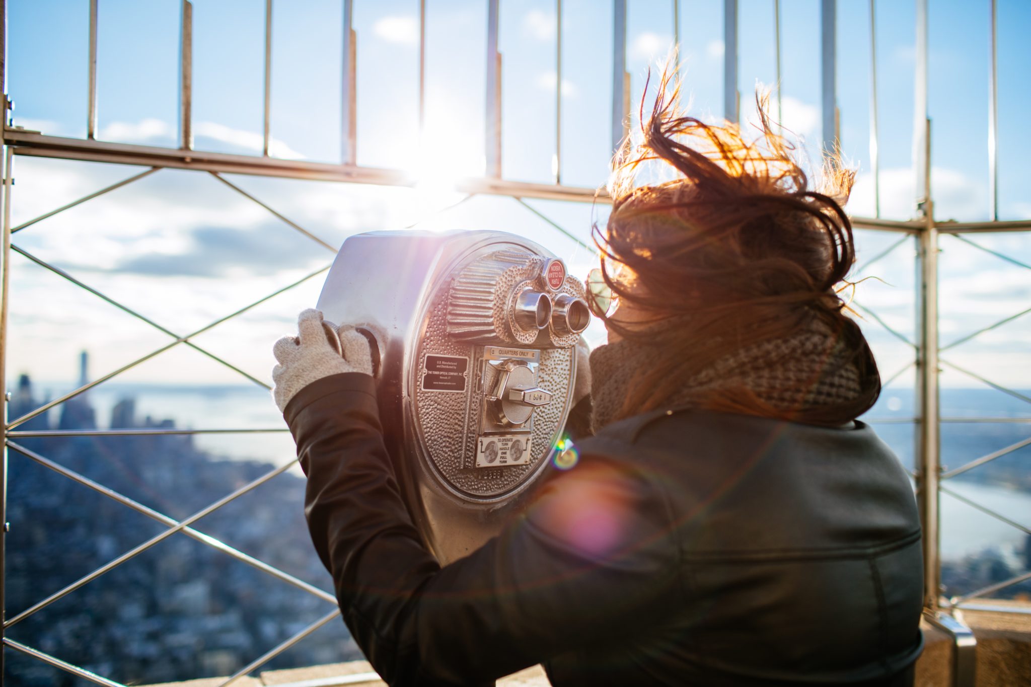 Woman looking through telescope