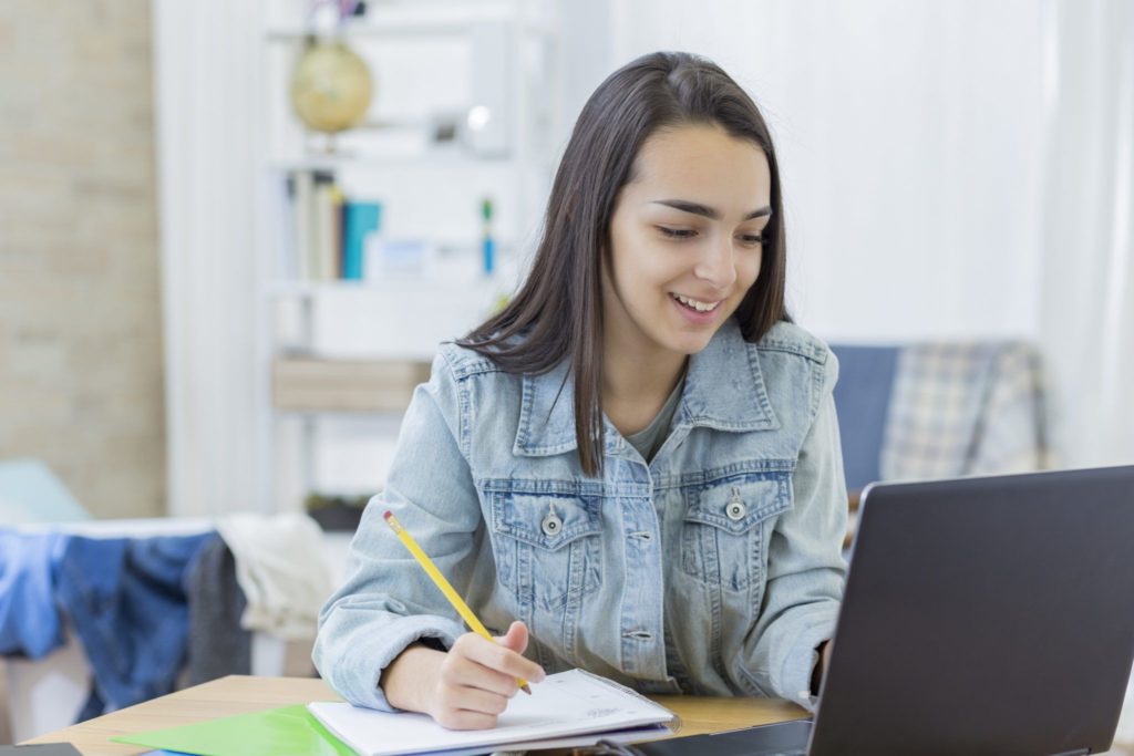 Confident student works on writing assignment
