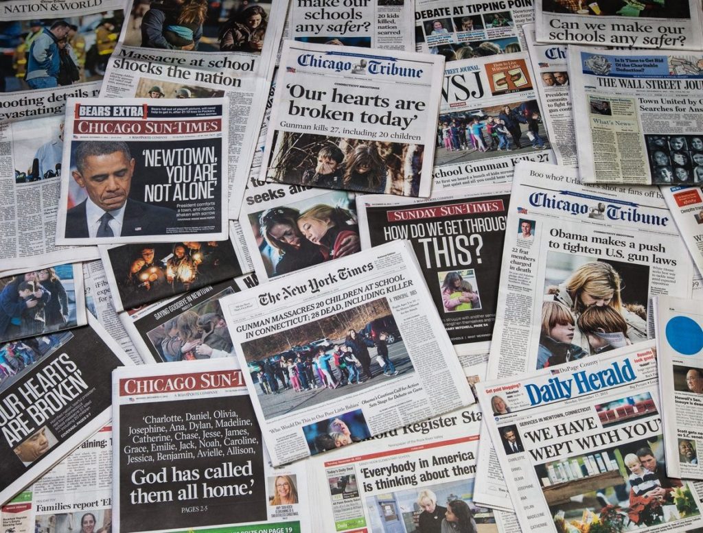 Newpapers showing headlines of school shootings