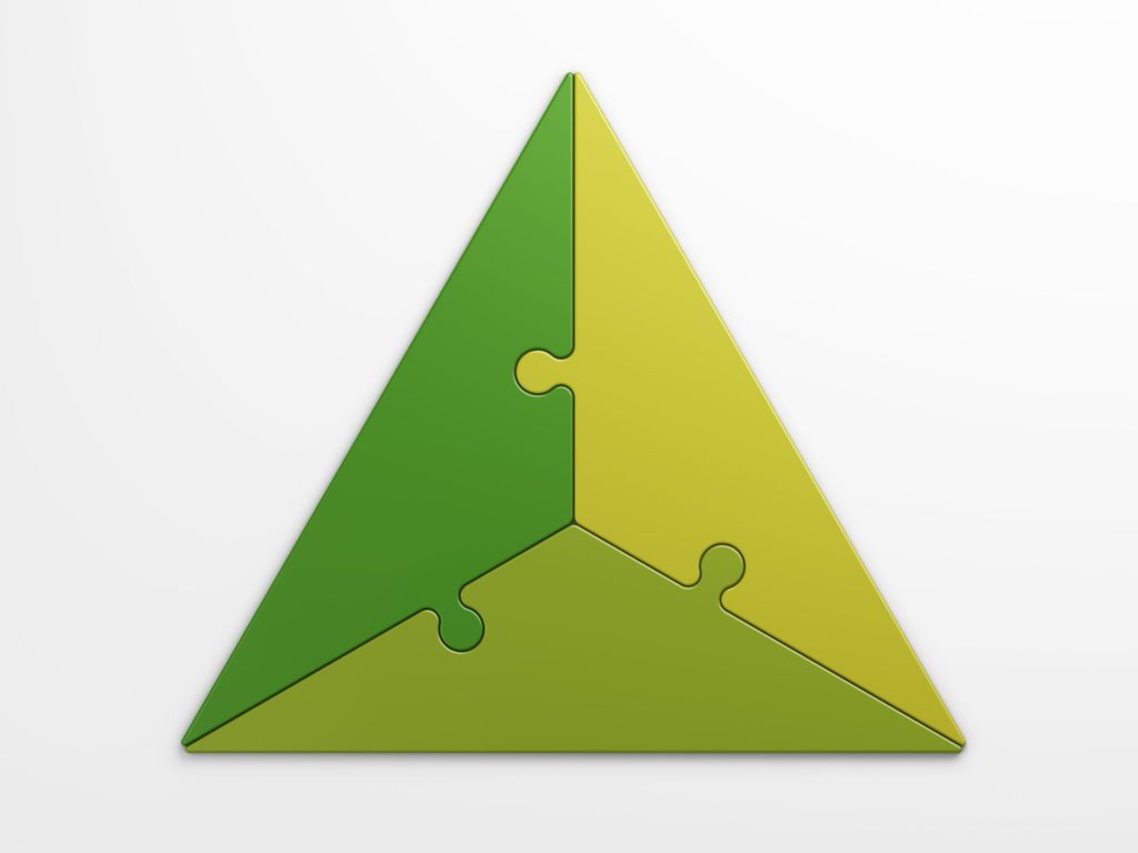 three pieces of a puzzle together forming a triangle