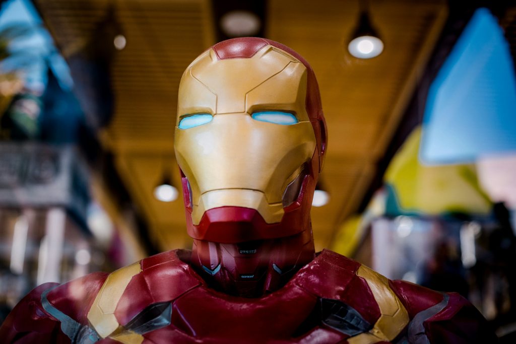 A close up view of a red and gold colored robot toy.